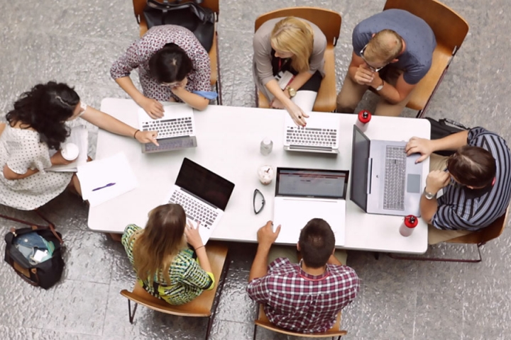 Overhead view of a group of student working together at a table